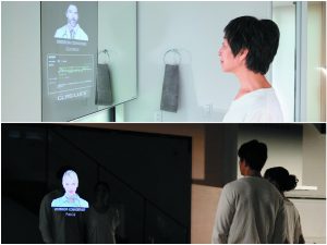 ▲上:洗面室のコンシェルジュ、下:共有スペースのコンシェルジュ。「この『Mirror Concierge』は株式会社ハナムラの製品で、ウェアラブル端末をわざわざ装着しなくても非接触で健康測定ができる点が先進の技術。将来的には体温・血圧・体重など測定項目を増やして、“特に意識しなくても自宅で毎日健康管理ができる暮らし”を目指しています」