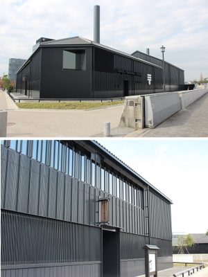 <写真上>おなじみのミツカンマークがある壁が、半田運河に沿った東側の面。下部に通風口があり、河川風を取り込む。2本の煙突は太陽熱を利用して中の空気の上昇を促す仕組み<写真下>南側の街路に沿った外壁。上部のガラスがある部分が二重構造になっているところ。ガラス面とその内側の木製壁の間が換気スペースに。ちなみに内側の木製壁は、かつて工場の外壁に使用されていた杉板が利用されている