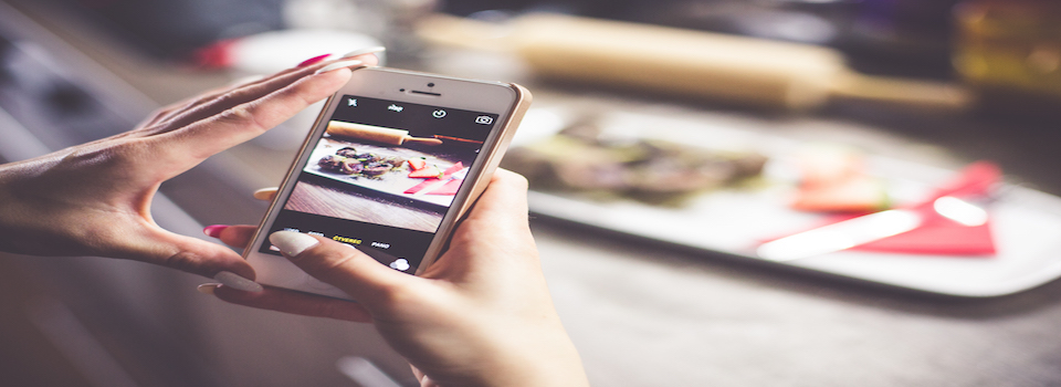 Girl taking a photo of her food with iphone picjumbo com