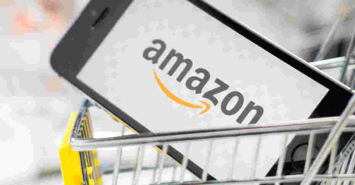 ショッピングカートにアマゾンのロゴ入りのスマホが乗ってる