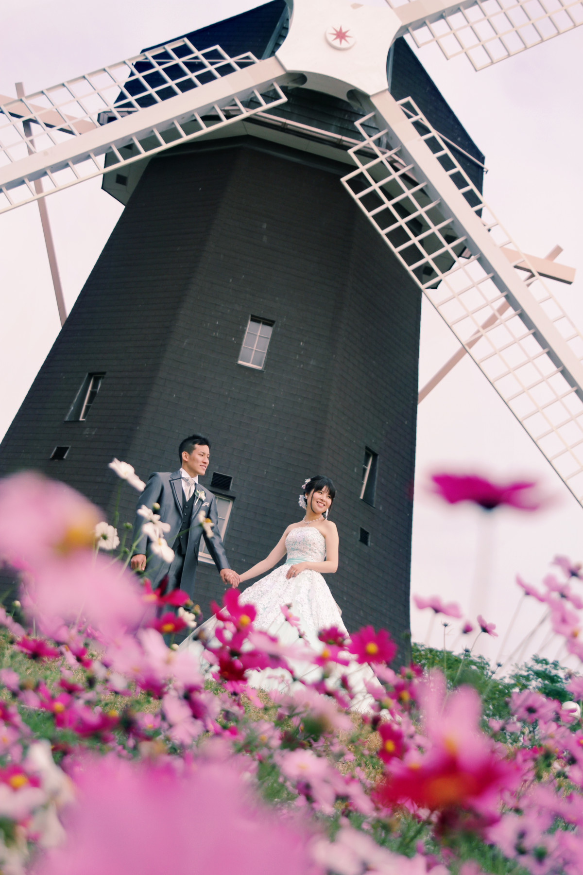 With the cosmos — Photo by CLAIRE Bridal Studio