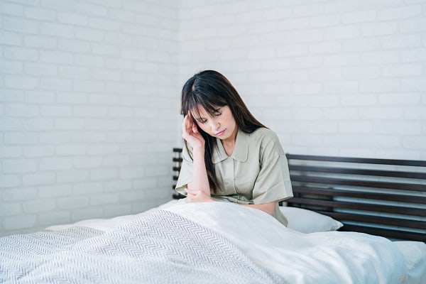 体調不良の女性