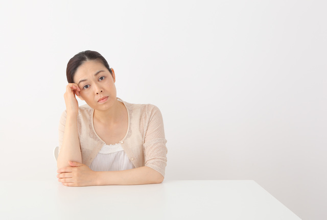 体調のわるい女性,PMS,妊娠,