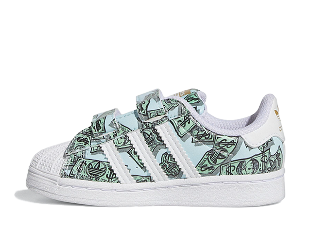 ジェレミー・スコット × アディダス キッズ スーパースター "マネープリント" フットウェアホワイト/ゴールドメタリック