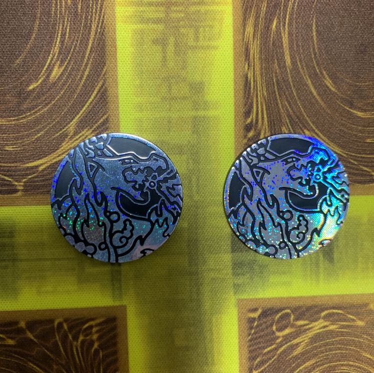 2 unused Charizard coins