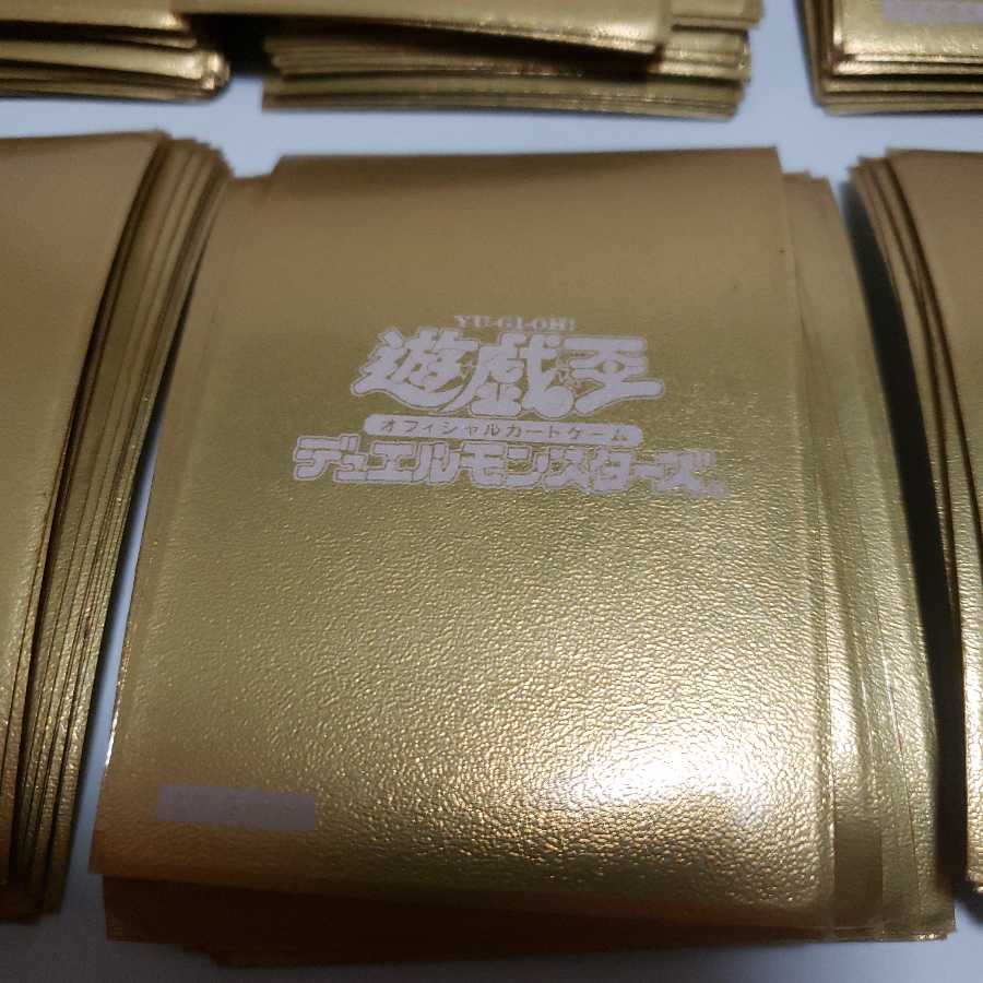 遊戯王　金ロゴ　スリーブ　開封済み　56枚 遊戯王 初期ロゴ スリーブ金 (Used) （2034442499）| magi -TCG