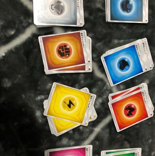12 Pokémon cards of all types of Energies