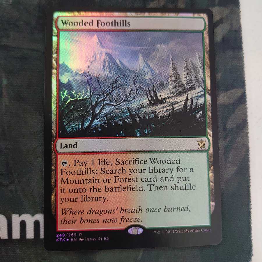 樹木茂る山麓 Foil 英語版