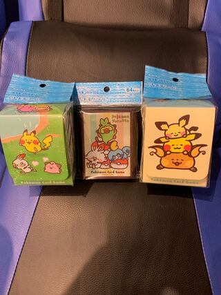 Two Kanahay collaboration deck cases and a deck shield (sleeve)