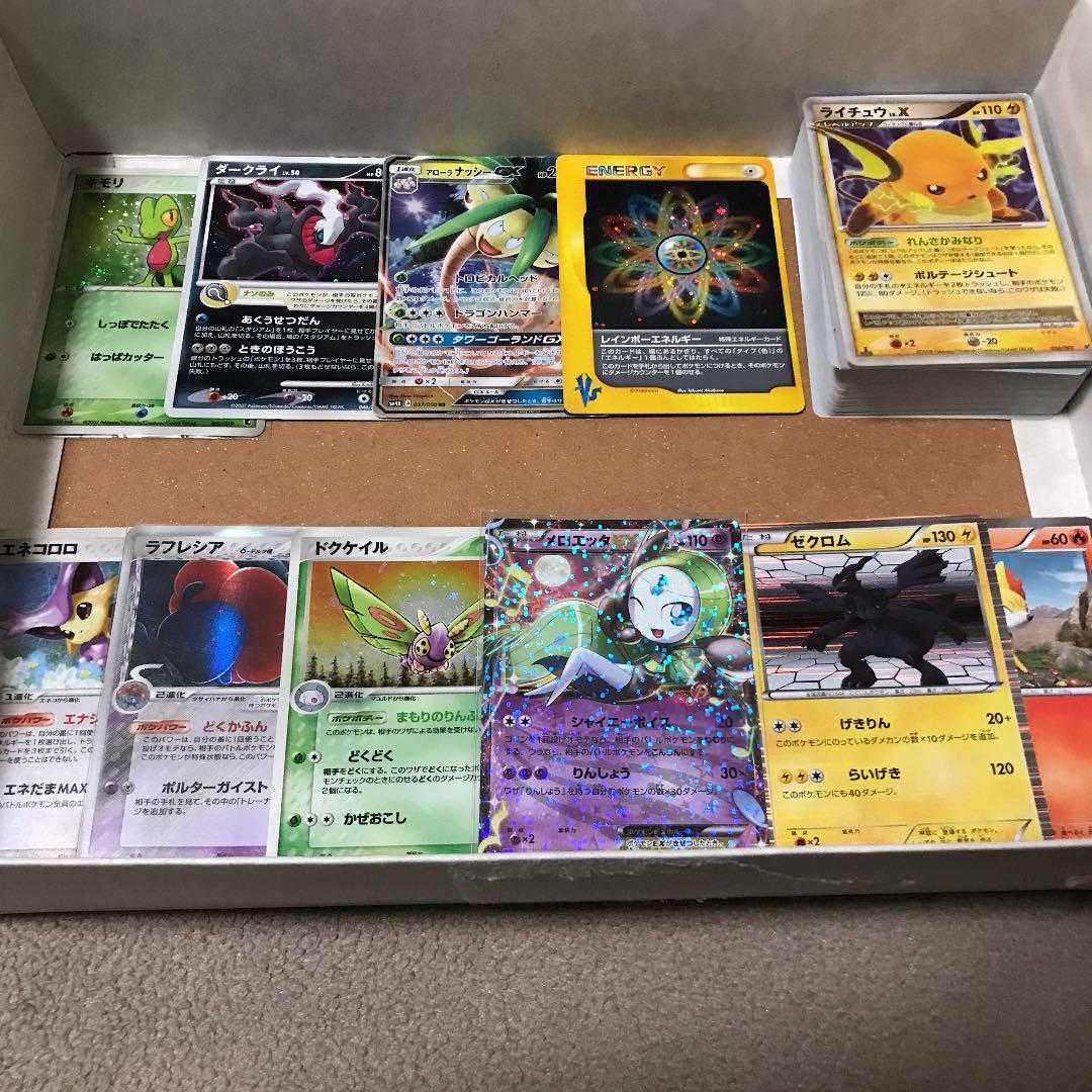 A set of about 100 cards including Delta, Raichulv.x, VSRainbowEnergy, etc.