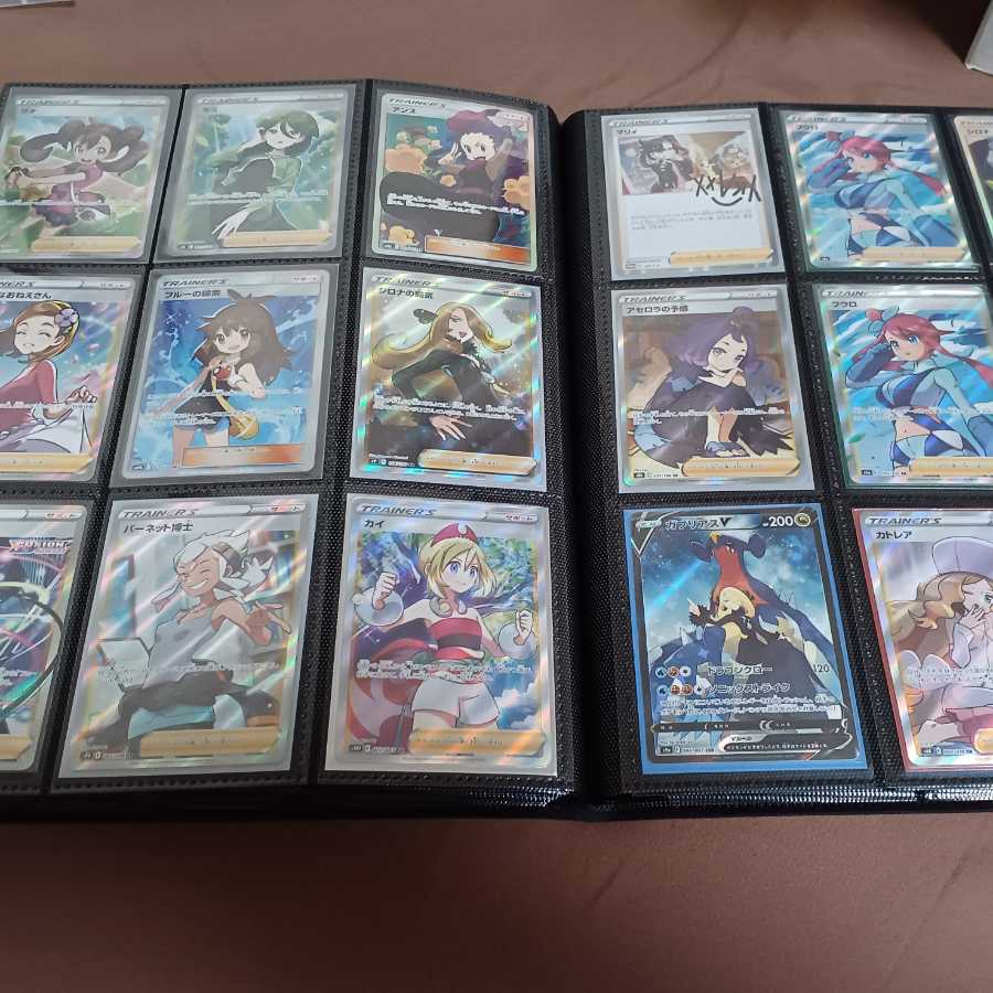 Assorted Pokemon cards with rare cards and unopened box