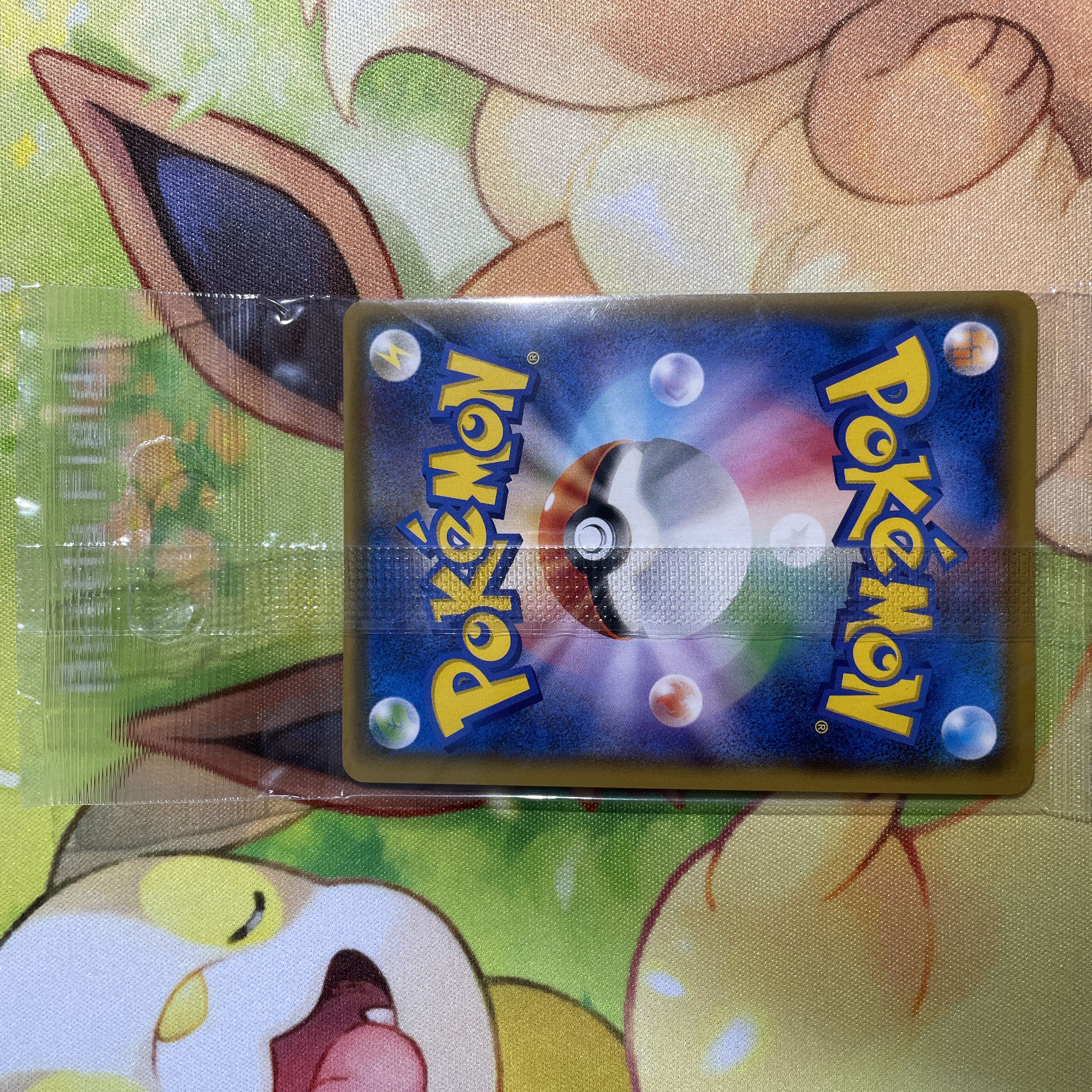 Eevee in poncho, unopened Sylveon PROMO 144/SM-P