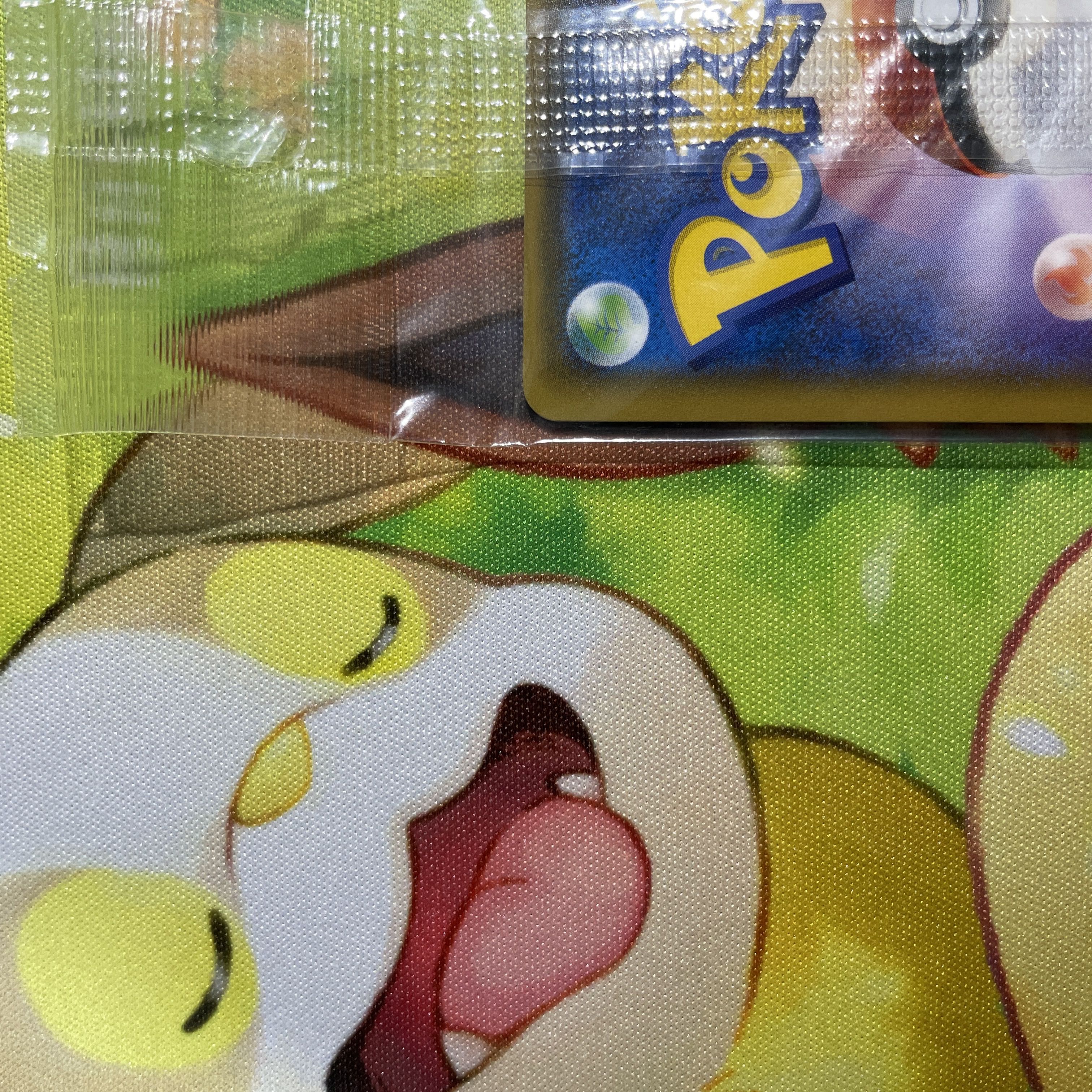 Eevee in poncho, unopened Sylveon PROMO 144/SM-P