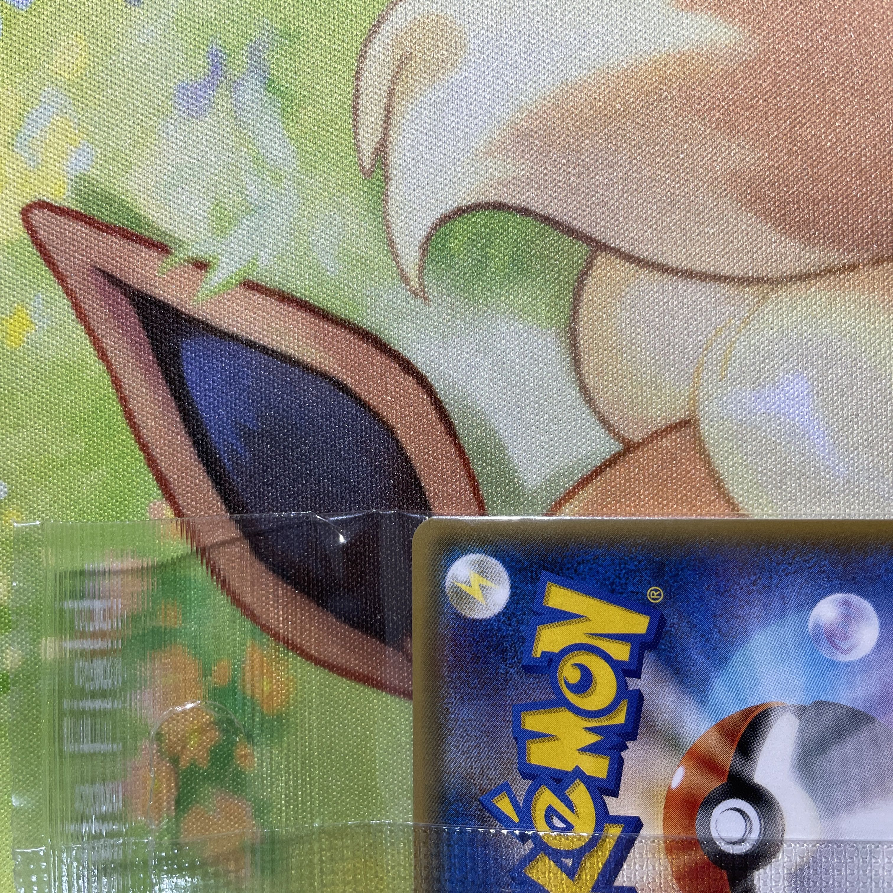 Eevee in poncho, unopened Sylveon PROMO 144/SM-P