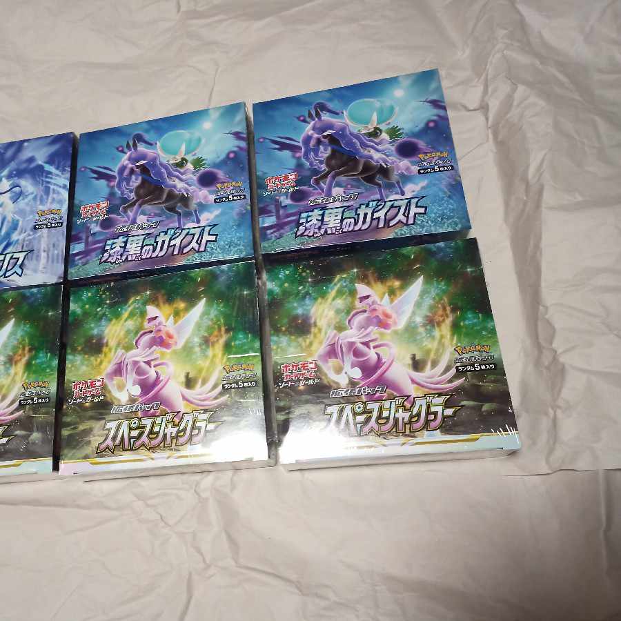 Shrink-wrapped Jet-Black Geist, White-Silver Lance, Space Juggler, 6 boxes total.