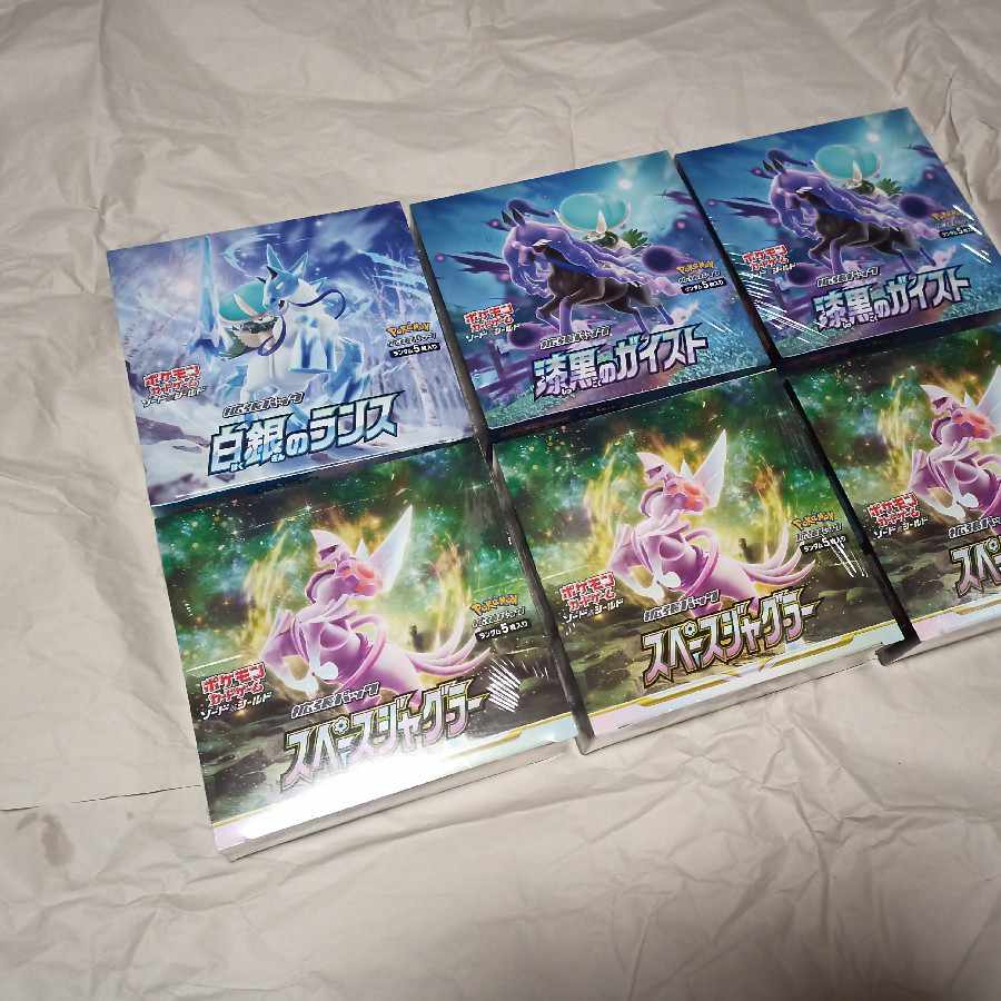 Shrink-wrapped Jet-Black Geist, White-Silver Lance, Space Juggler, 6 boxes total.