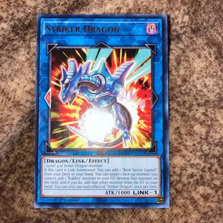 Striker Dragon English Gold Rare slightly out of frame with extras.