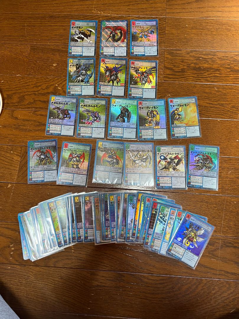 Assorted Digimon cards including Dukemon, Metalgreymon, etc.
