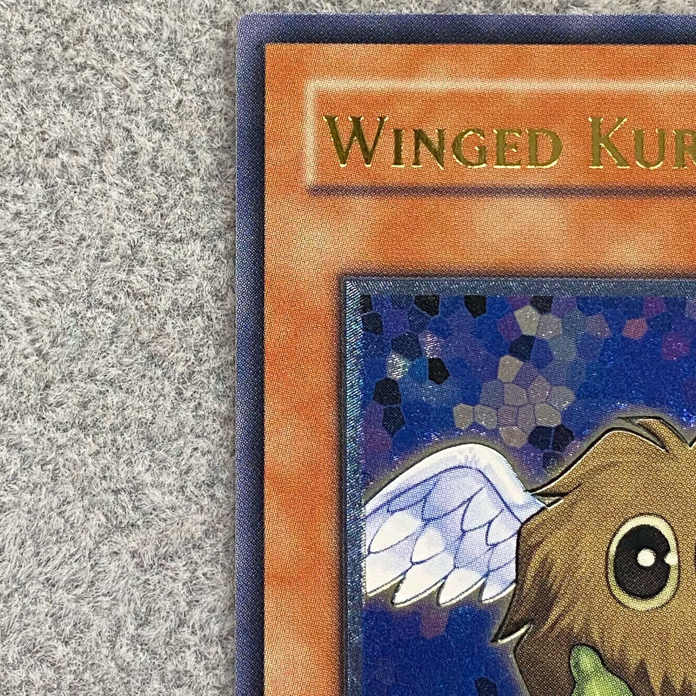 Winged Kuriboh Asia <1st> [relief] {TLM-AE005}.