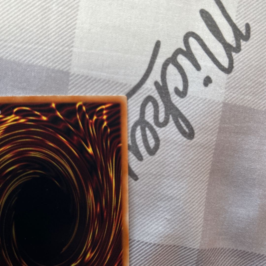 Stardust Dragon relief with scratches