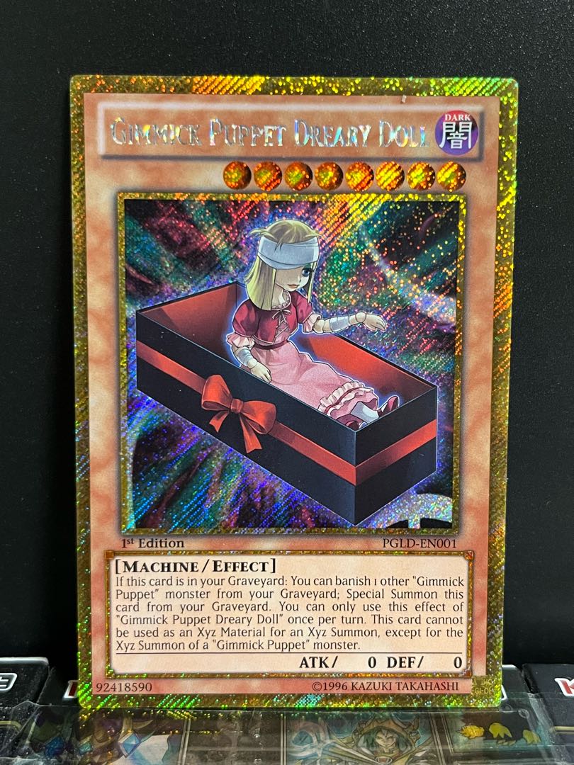 Yu-Gi-Oh Studio 10229 [English Version] Gimmick Puppet - Necro Doll Gold Secret Rare EN001 1 copy