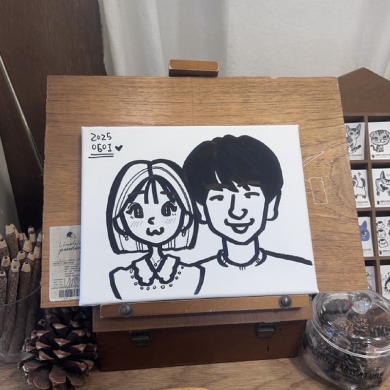 マ