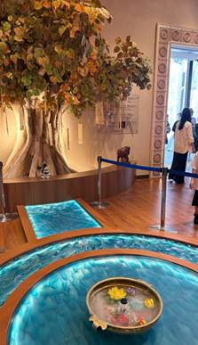 A tree in a room
Description automatically generated