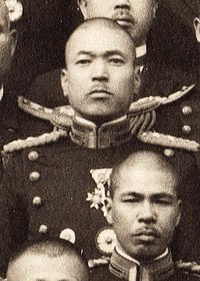 谷萩那華雄の画像