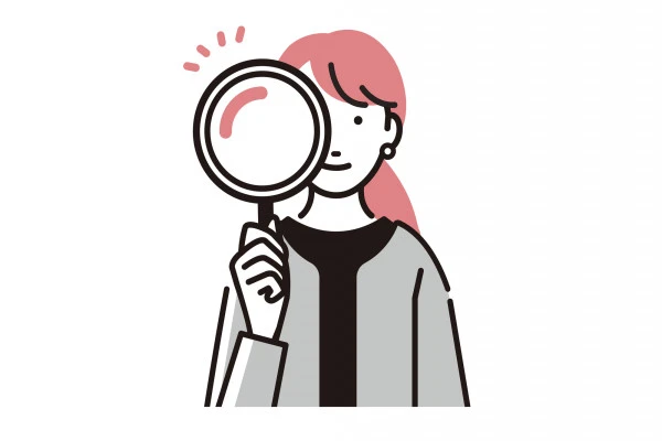 虫眼鏡を覗いている女性
