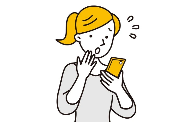 スマートフォンを見ながら焦っている女性のイラスト
