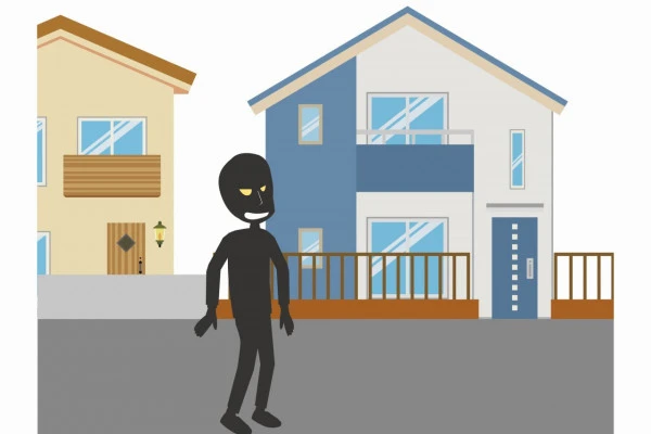 家を物色する空き巣泥棒のイラスト