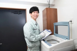 洗濯機の不用品回収に訪れた作業員の写真