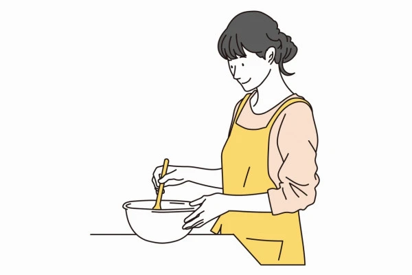調理をする女性のイラスト