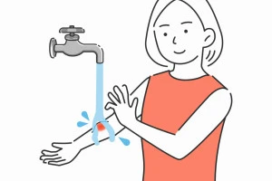 蜂に刺された幹部を洗い流している女性のイラスト