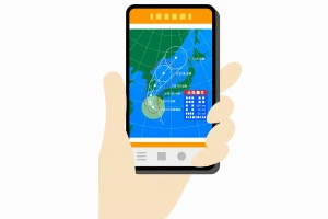 スマホで天気予報をチェックしている様子