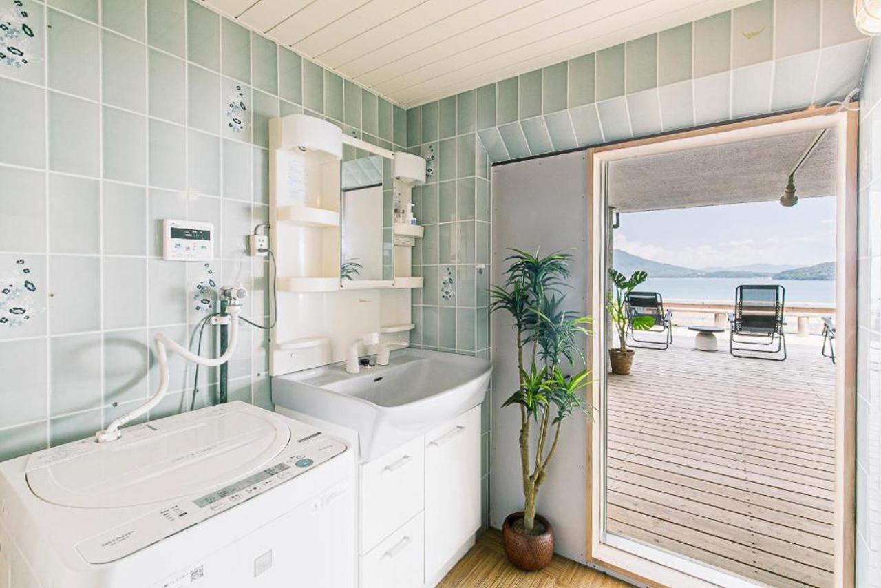 糸島市志摩芥屋の売買物件/お風呂の横は洗面、洗濯スペース