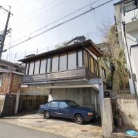 京都府京都市北区西賀茂今原町の賃貸物件/斜面に沿って建つRC造4階建て