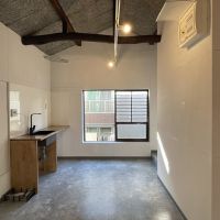 北区田端の賃貸物件/西側のスペース。キッチンや洗濯機置き場がまとまっている