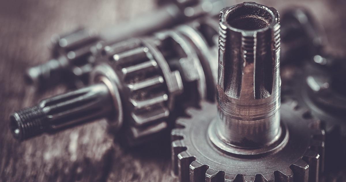gearwheel of the old engine on the wooden table