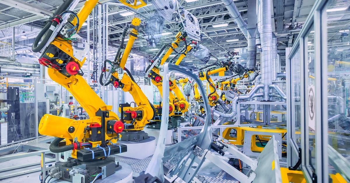 robotic arms in a car plant