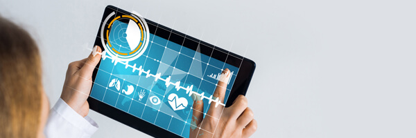 Close of female doctor hands working with tablet pc computer