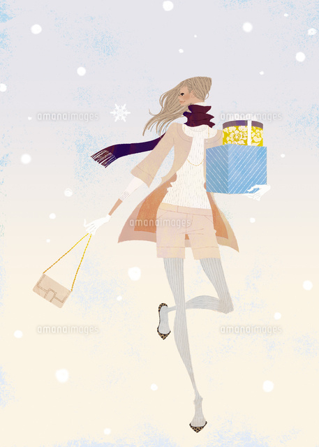 雪の中プレゼントを持って走る女性
(c)Yuko Yoshioka