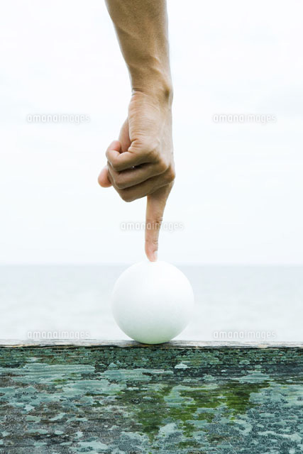 Hand touching ball with forefinger
(c)Sandro Di Carlo Darsa/Photo Alto