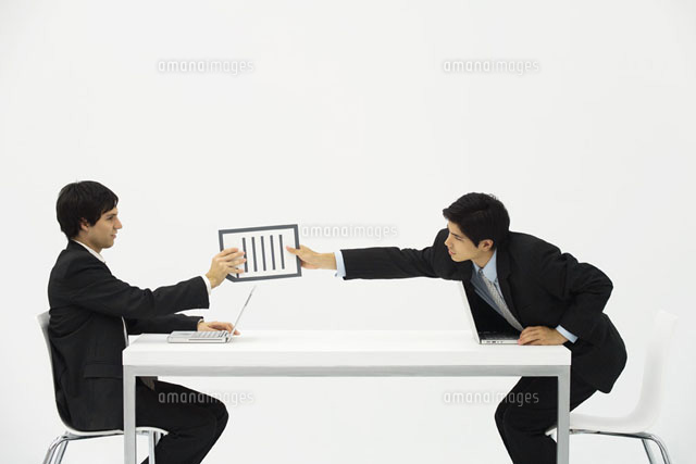 Two business associates sitting face to face at desk
(c)Ale Ventura/PhotoAlto