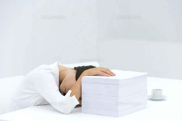 Woman with head down on desk, arm obscuring face
(c)Alix Minde/PhotoAlto