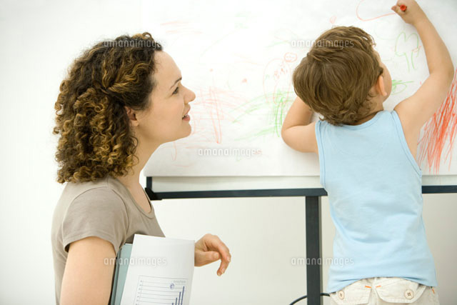 Professional mother holding documents, watching son color
(c)Alix Minde/PhotoAlto
