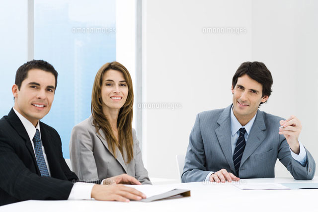 Business associates having meeting,all smiling at camera
(c)Frederic Cirou/PhotoAlto