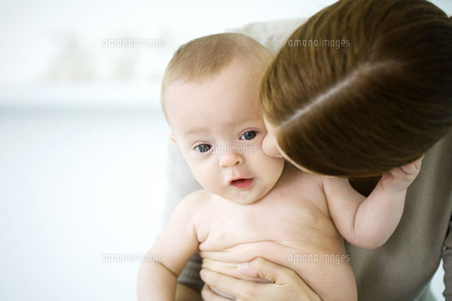 Woman kissing baby’s cheek,baby looking at camera
(c)Ale Ventura/PhotoAlto