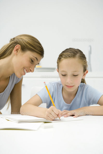 Girl doing homework at table,mother watching
(c)Sigrid Olsson/PhotoAlto