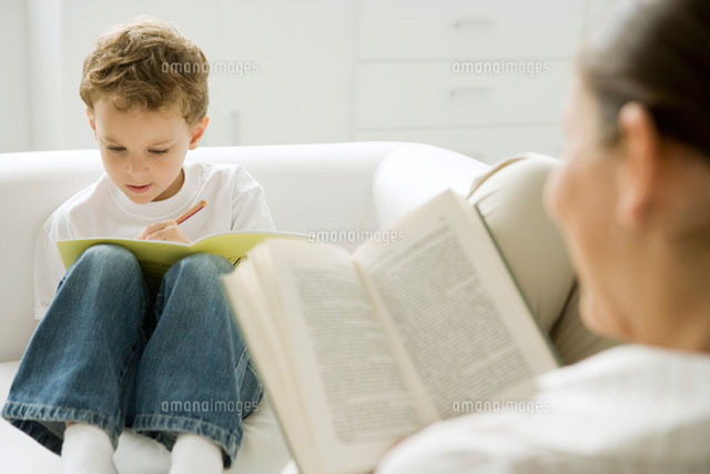 Boy sitting on sofa,writing in book
(c)Sigrid Olsson/PhotoAlto